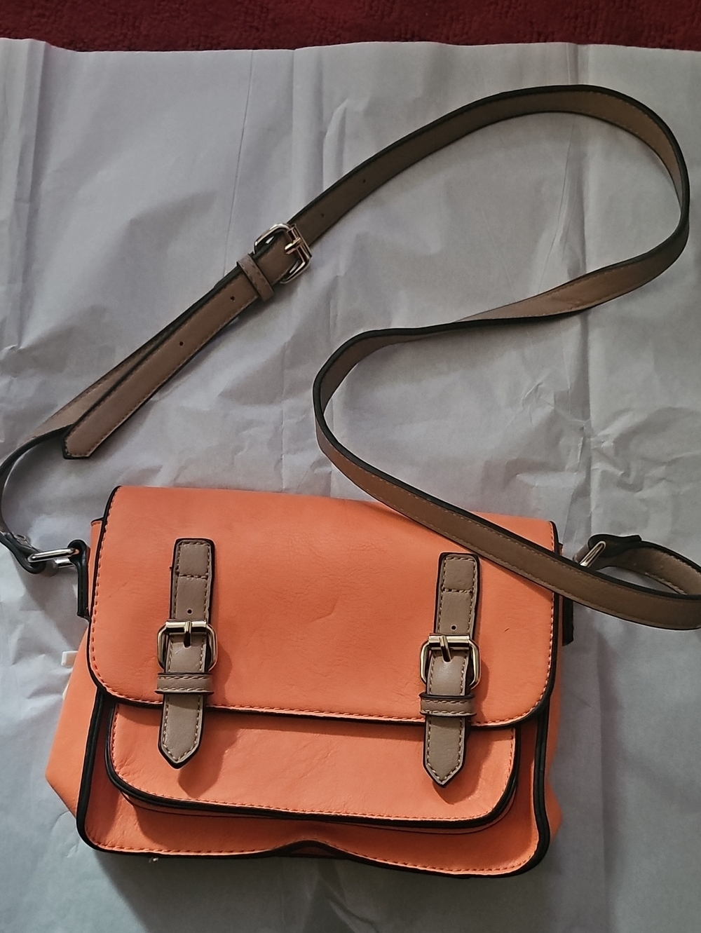 Simply Noelle Tangerine Crossbody Bag with Taupe Strap and Buckle Accents